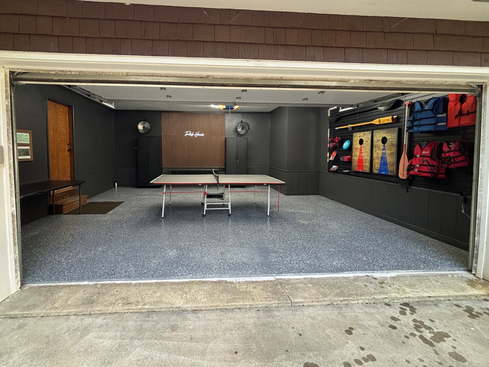 Signature transformation: personalized lifestyle garage with hex lighting, custom cabinets, and coated flooring — after